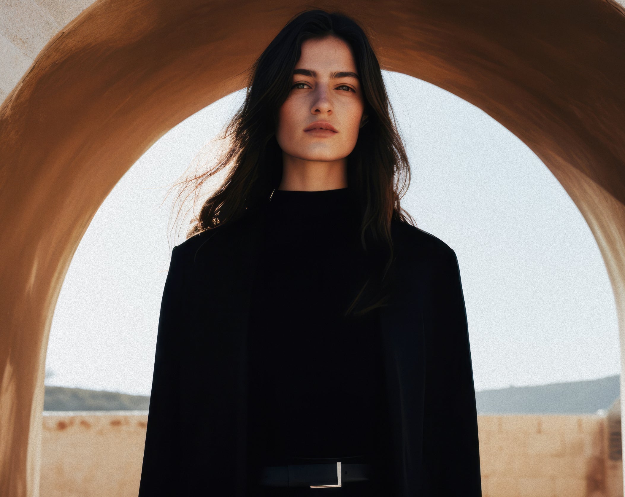 Empowering Silhouettes and Understated Elegance in Natural Architectural Backdrops